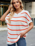 Orange-and-white striped knit sweater with loose oversized fit and wide short sleeves