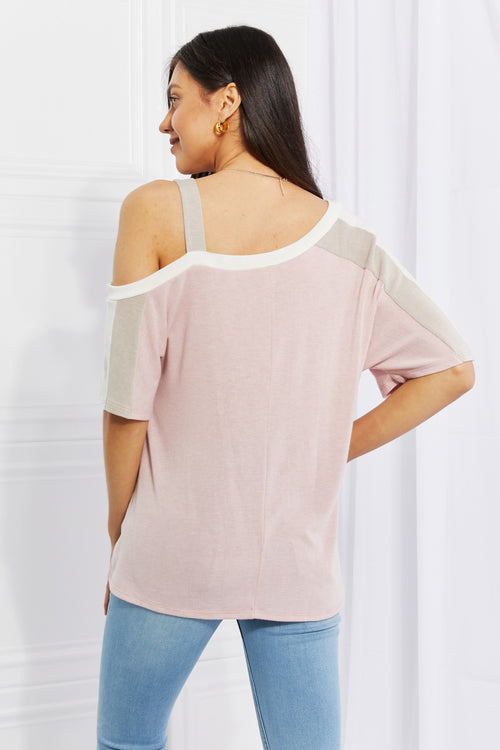Dusty pink cold shoulder T-shirt showing back cutouts and white shoulder trim