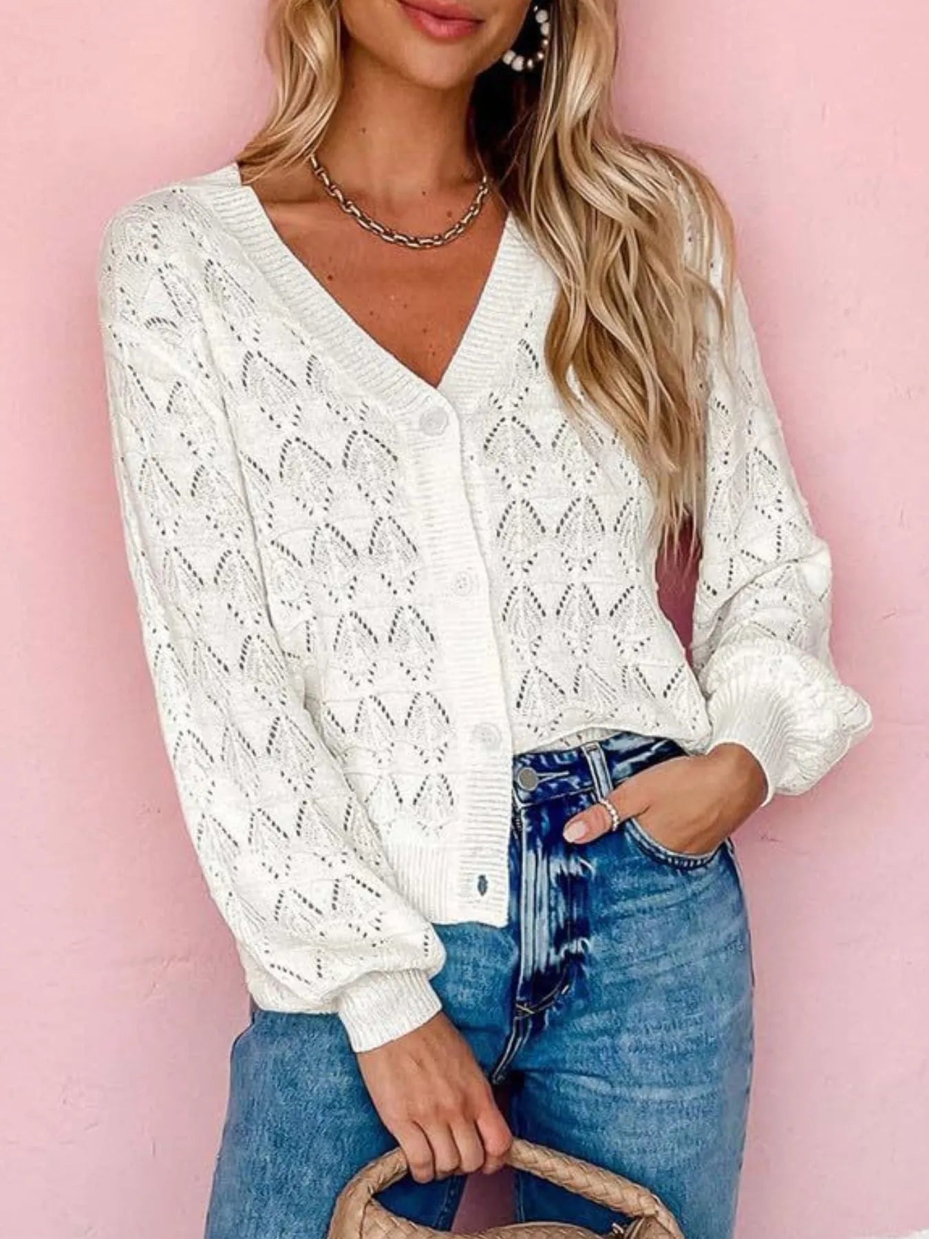 White openwork button-up cardigan with V-neck, long sleeves, and diamond knit eyelet