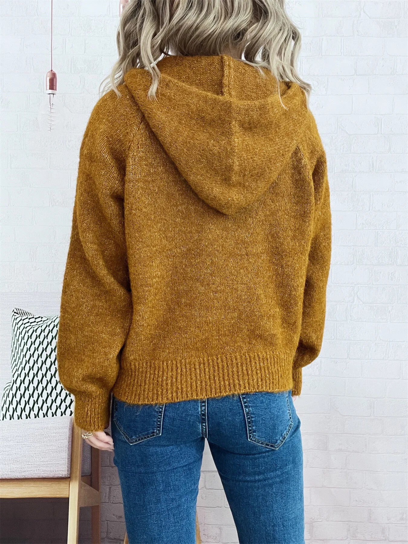 Brown quarter-zip sweater from back with ribbed hem and long sleeves