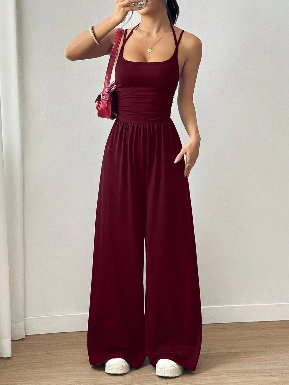 Ruched spaghetti-strap wide-leg jumpsuit, wine red sleeveless bodice with gathered waist