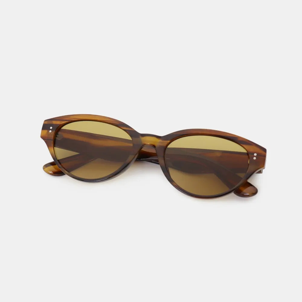 Brown polycarbonate cat-eye sunglasses with dark tinted lenses and slim arms