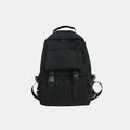 Black backpack with front flap pocket, top handle, and adjustable shoulder straps