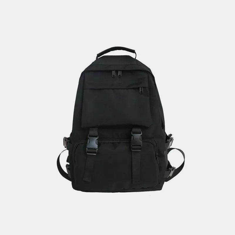 Black backpack with front flap pocket, top handle, and adjustable shoulder straps