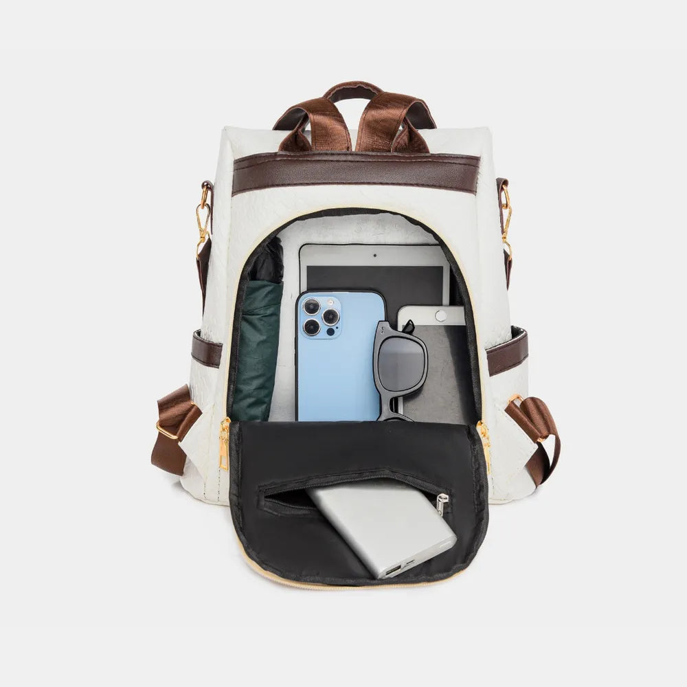 Vegan leather backpack bag in ivory with brown trim, front zipper and side straps