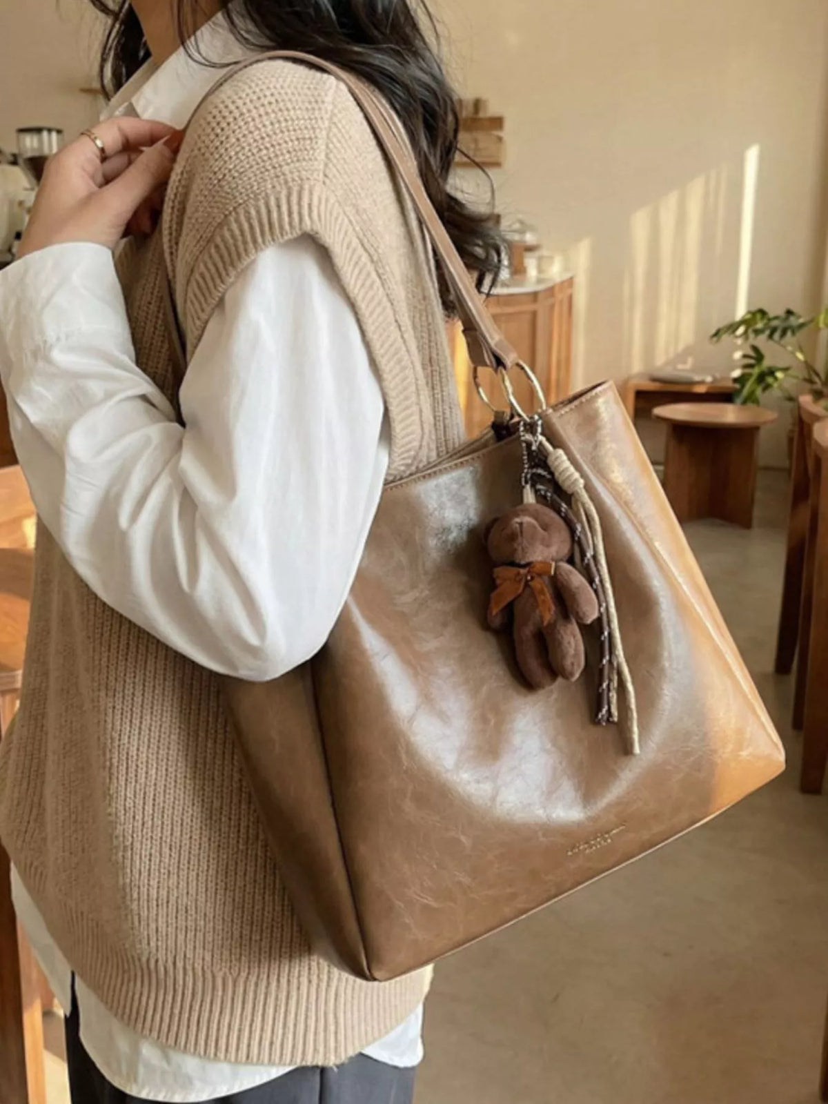 Khaki vegan leather medium shoulder bag with teddy charm tassels and braided handle