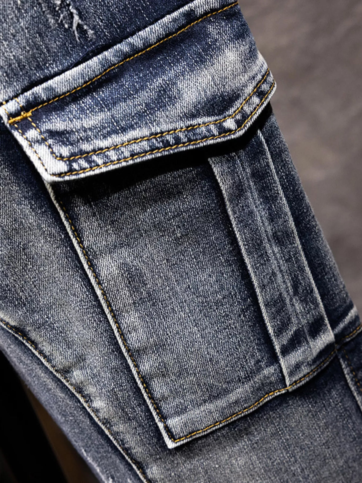 Men's medium-wash cotton cargo pocket with flap and contrast stitching