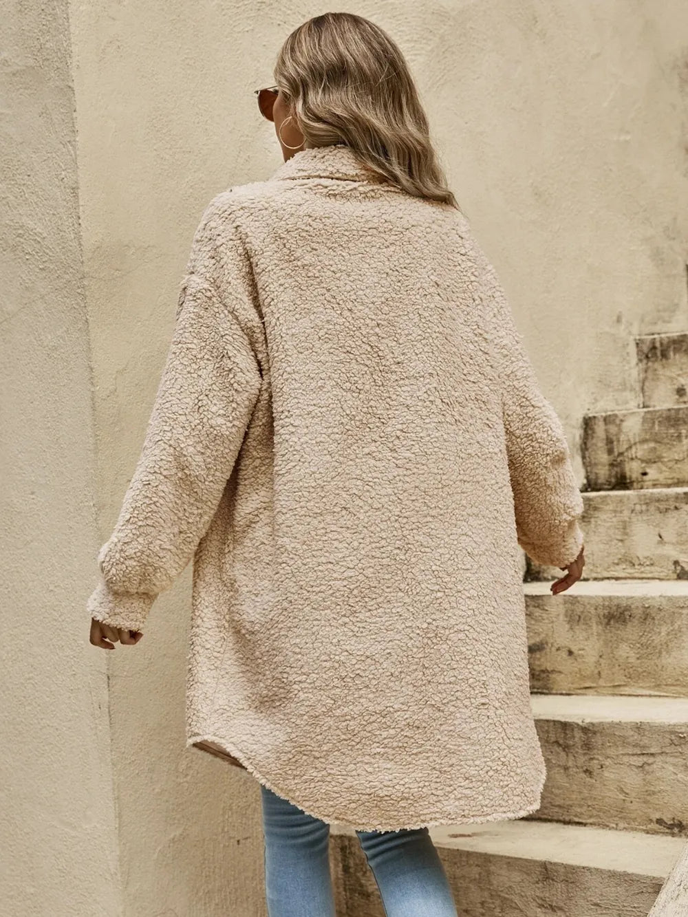Camel sherpa collared button-front coat with long sleeves, snap-style buttons.