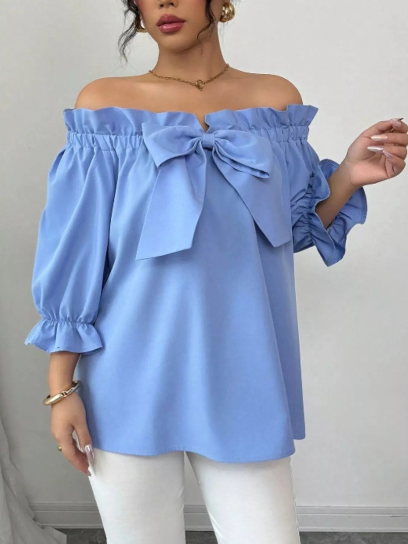 Bow Flounce Sleeve Blouse, light blue off-shoulder top with a front bow and puff sleeves by Trendsi.