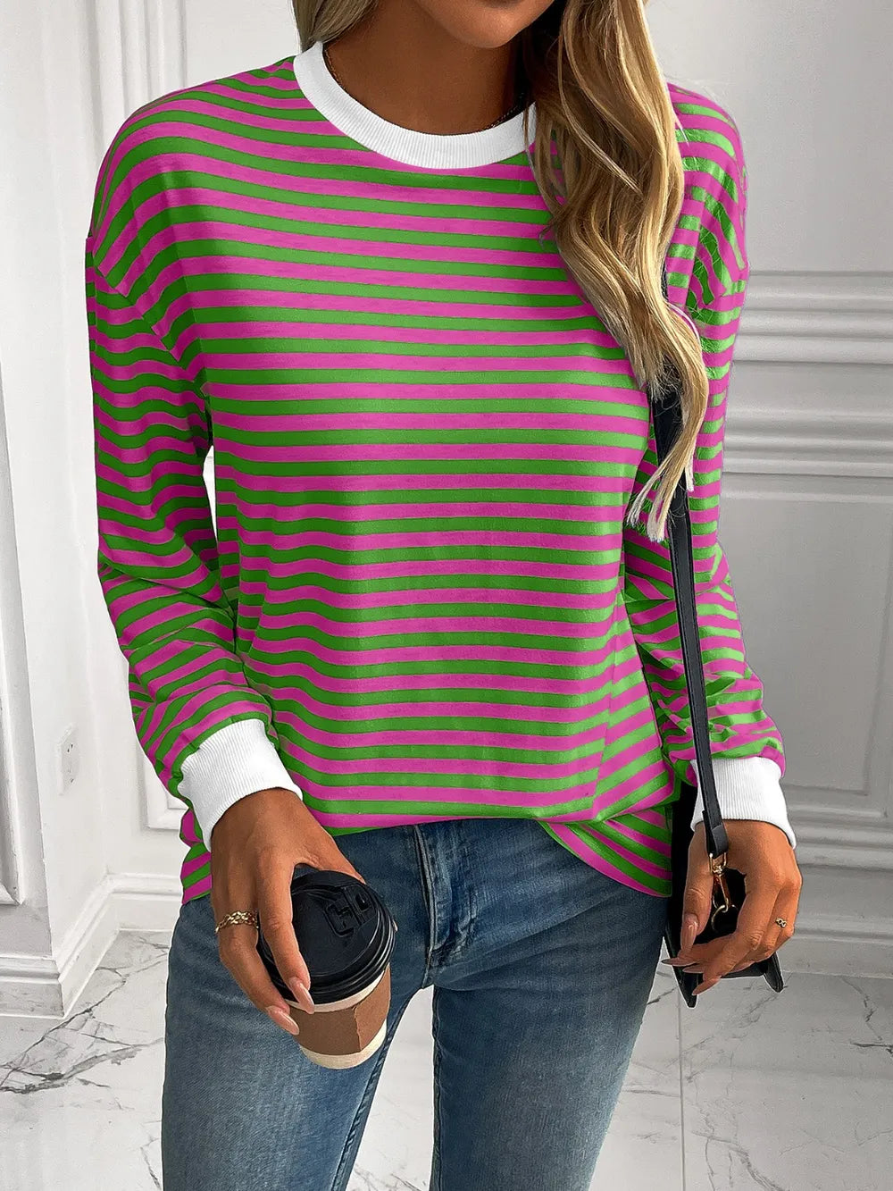 Green and pink striped round-neck sweatshirt with long sleeves and white cuffs