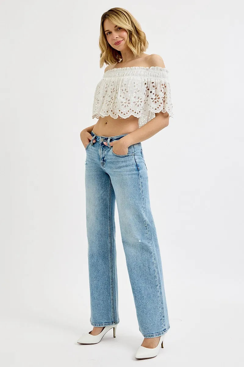 Medium-wash low-rise boyfriend jeans, ankle length, side-front view