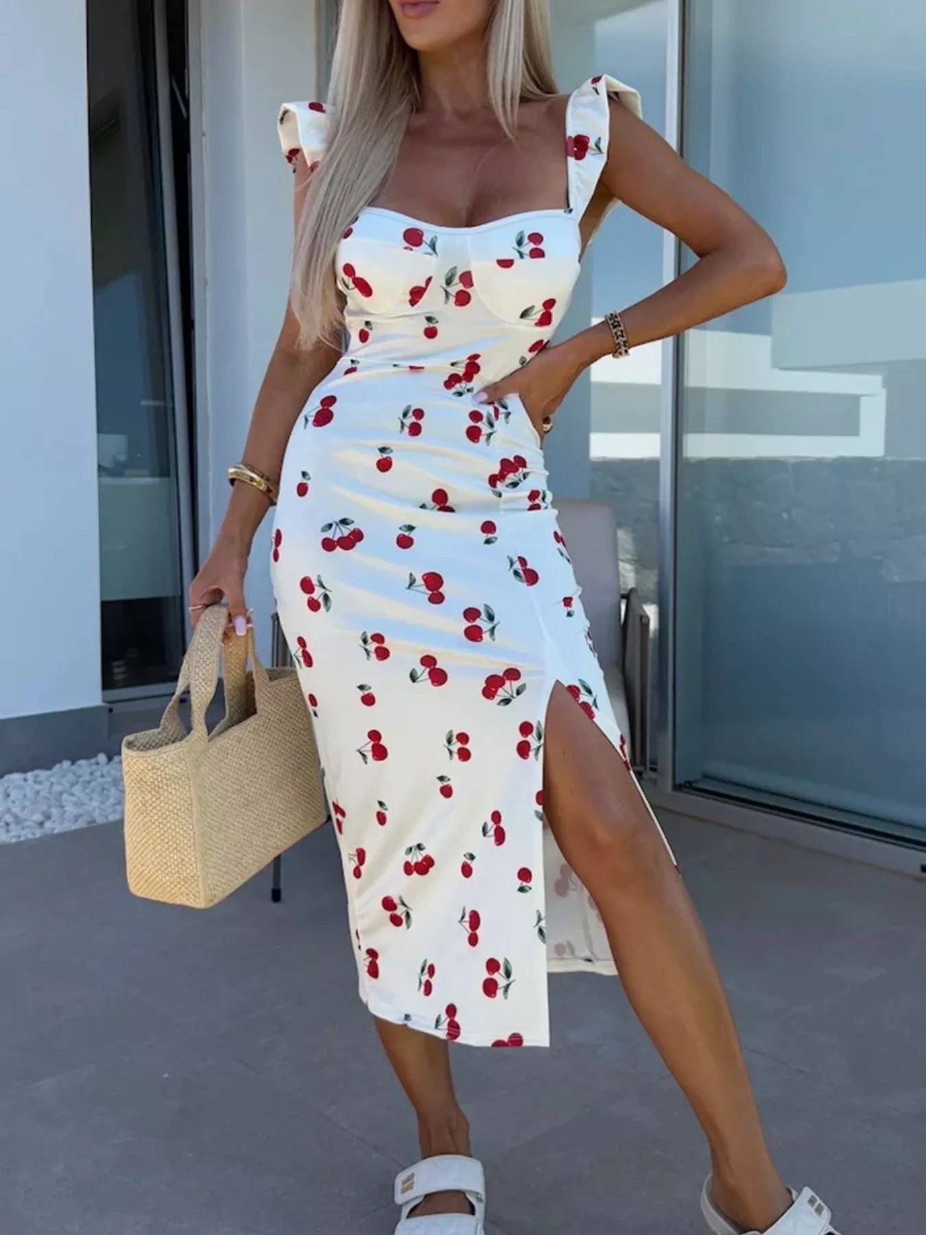 White midi dress with cherry print, sweetheart neckline, ruffled straps, thigh slit