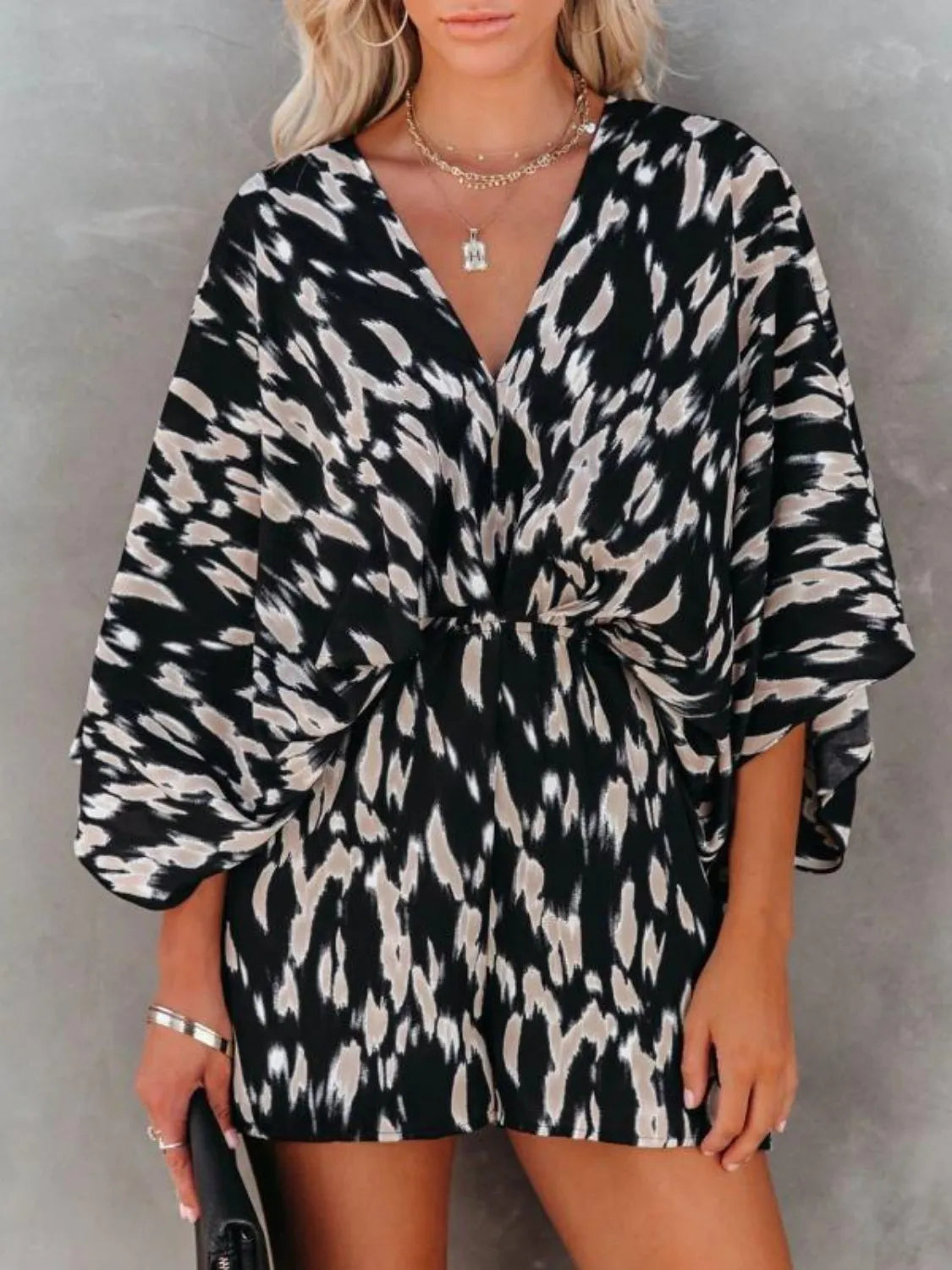 Leopard printed romper with V-neck, black-and-white abstract pattern, loose sleeves