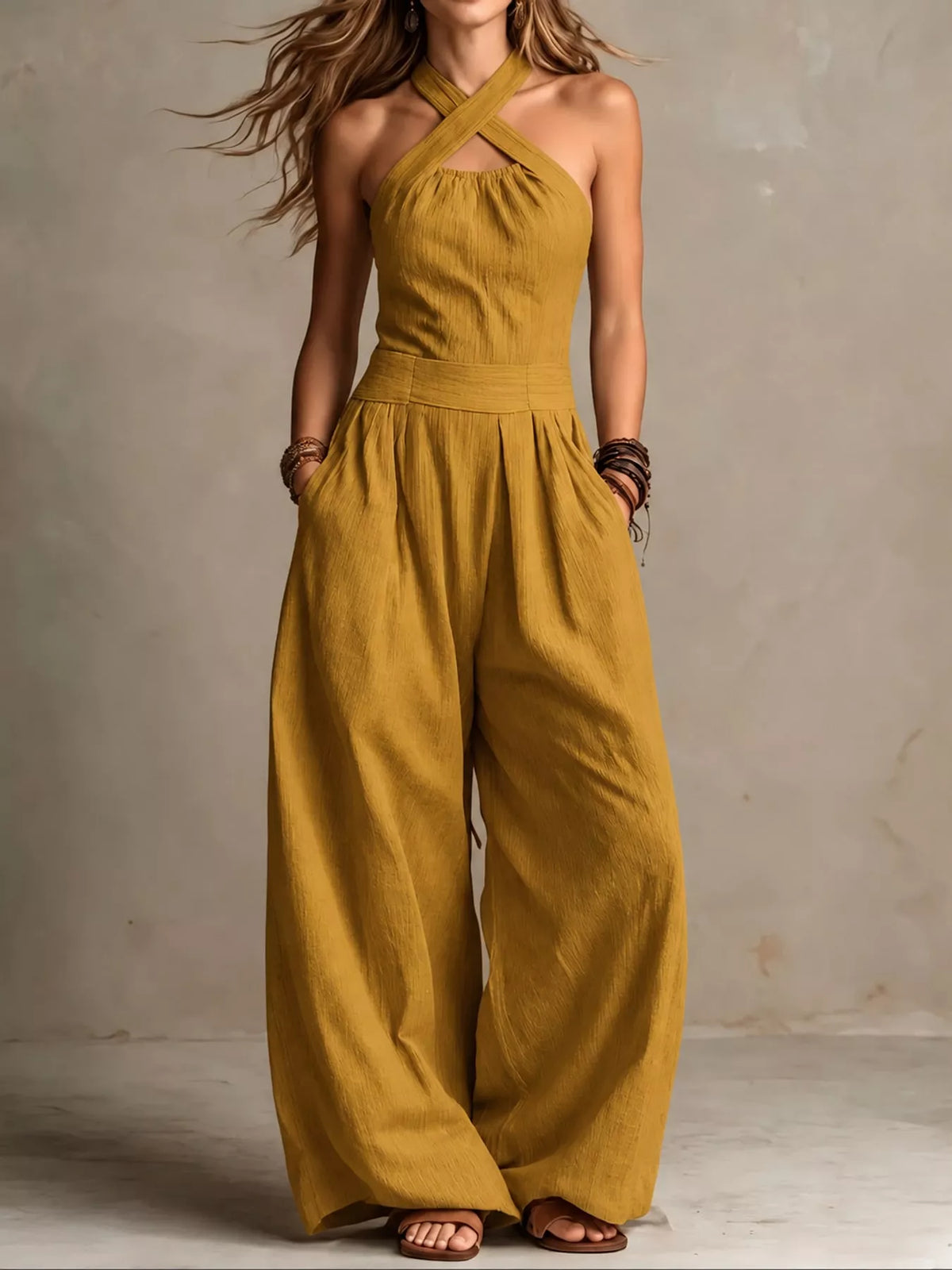 Yellow linen halter jumpsuit with high waist and flowy wide legs