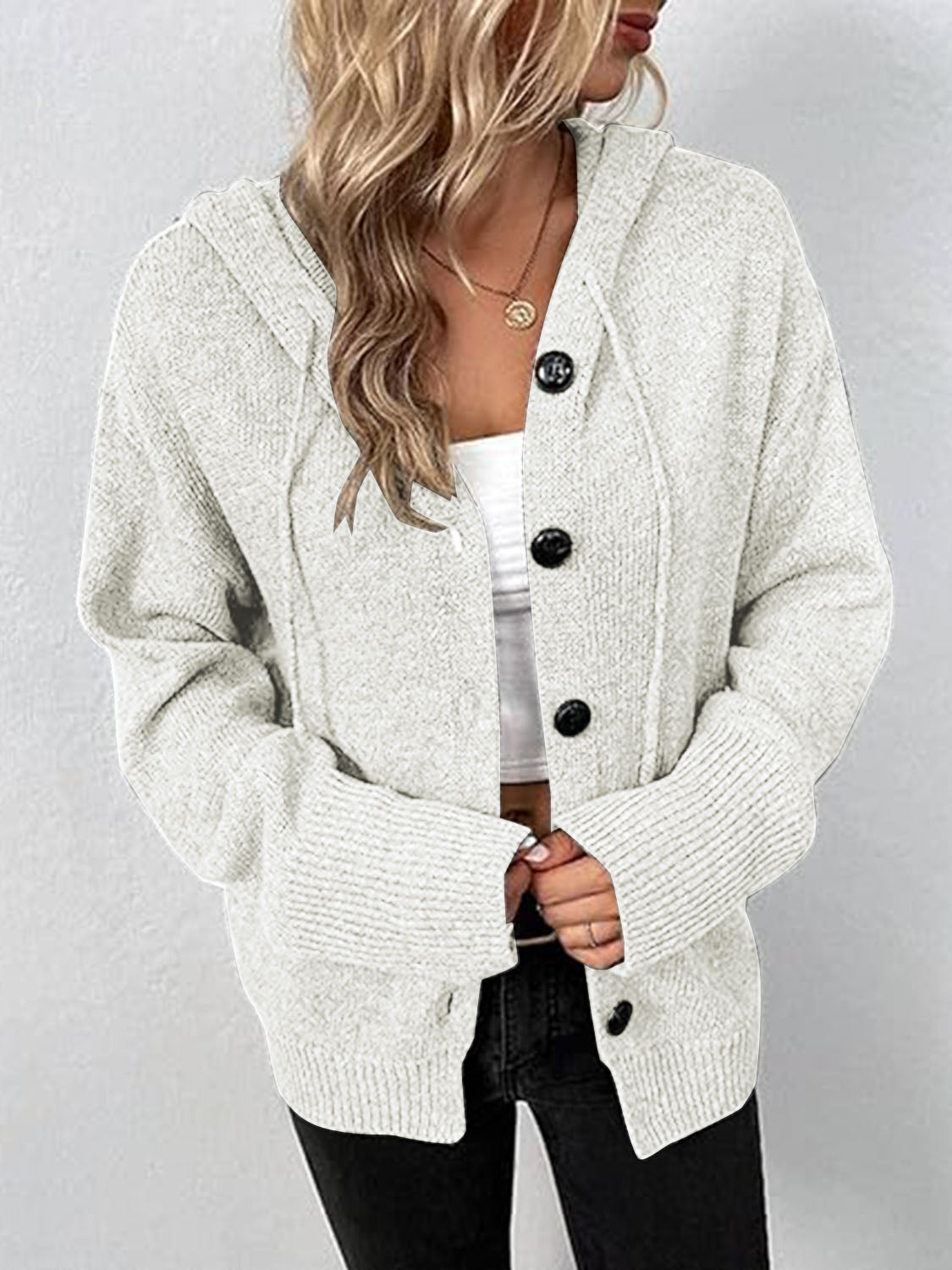 White hooded button cardigan with long sleeves and ribbed cuffs