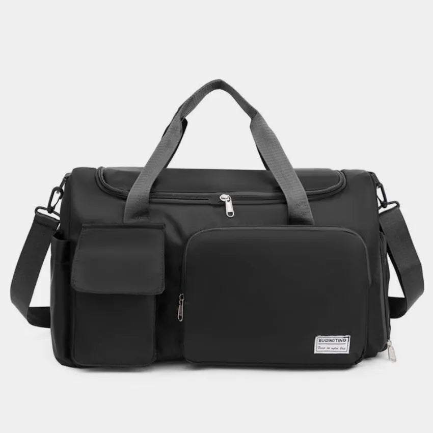 Large travel duffle bag with detachable straps, black with front zip pocket and label.