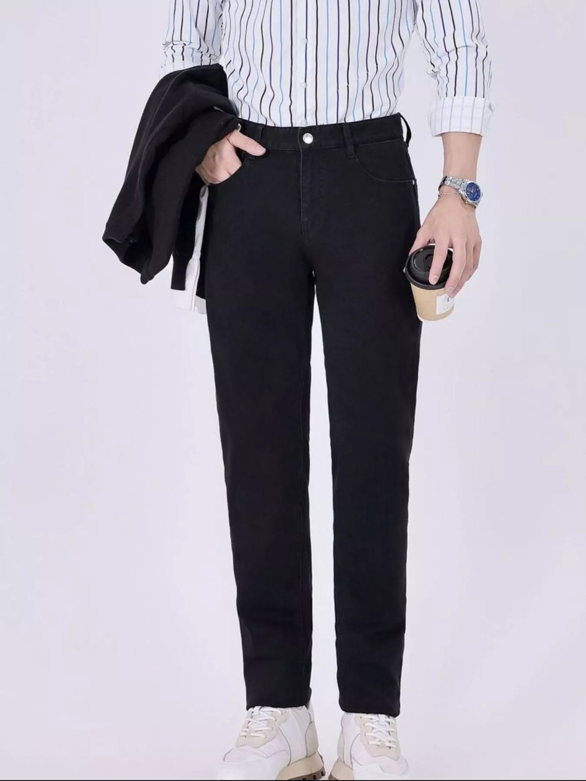 Black slim-fit jeans with zip fly, belt loops, and tapered leg opening