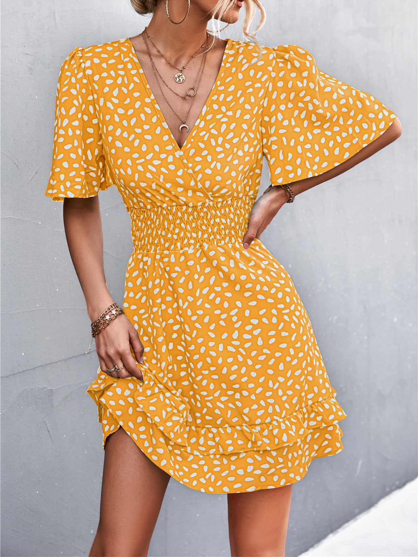 Mustard yellow surplice mini dress with white abstract print, puff short sleeves, smocked waist