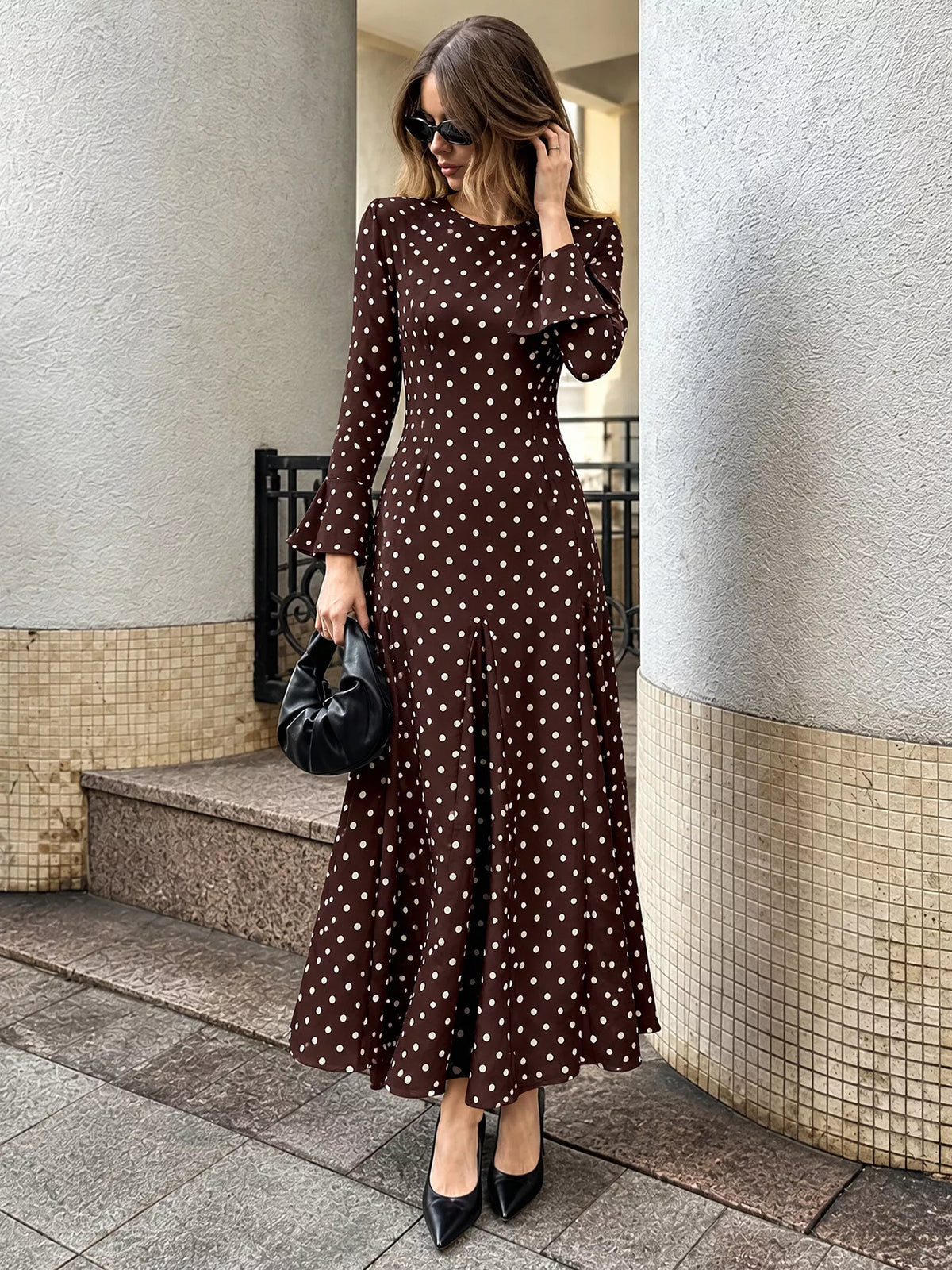 Coffee brown polka dot long-sleeve maxi dress, front view with round neckline