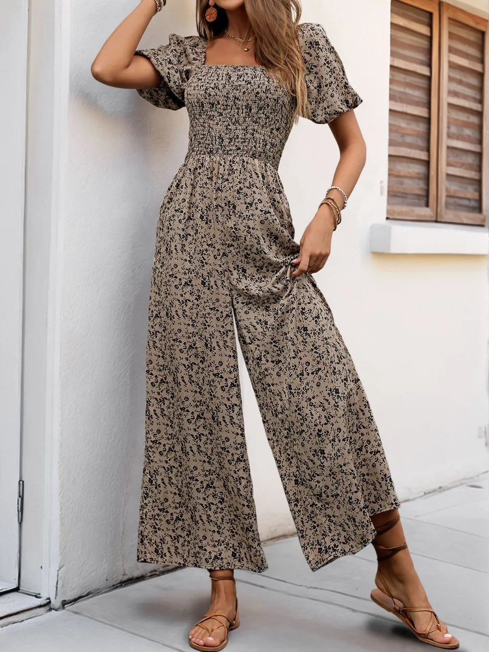 Taupe smocked square-neck jumpsuit with puff sleeves and wide flared legs