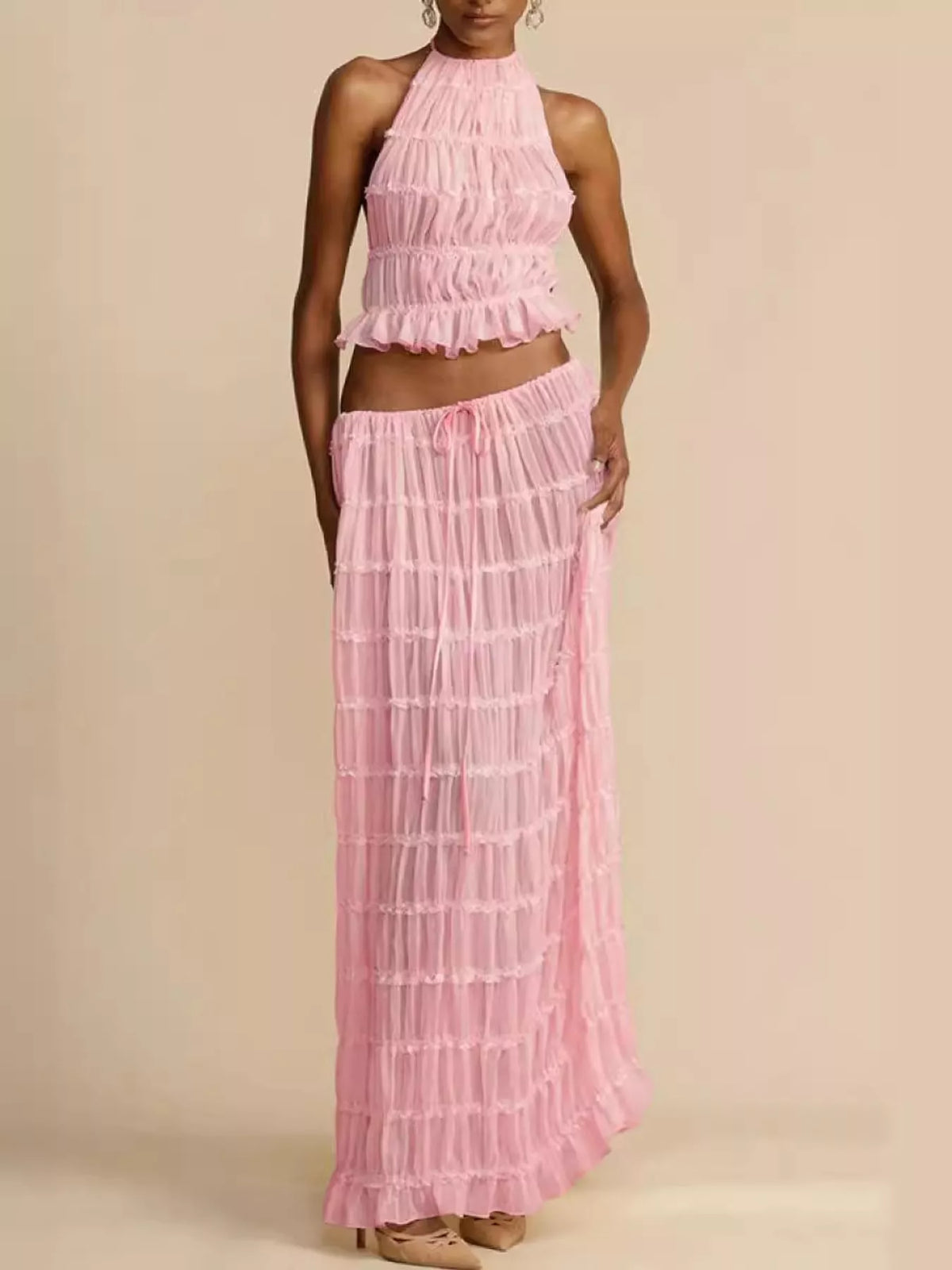 Pink halter ruffle crop top and tiered maxi skirt set