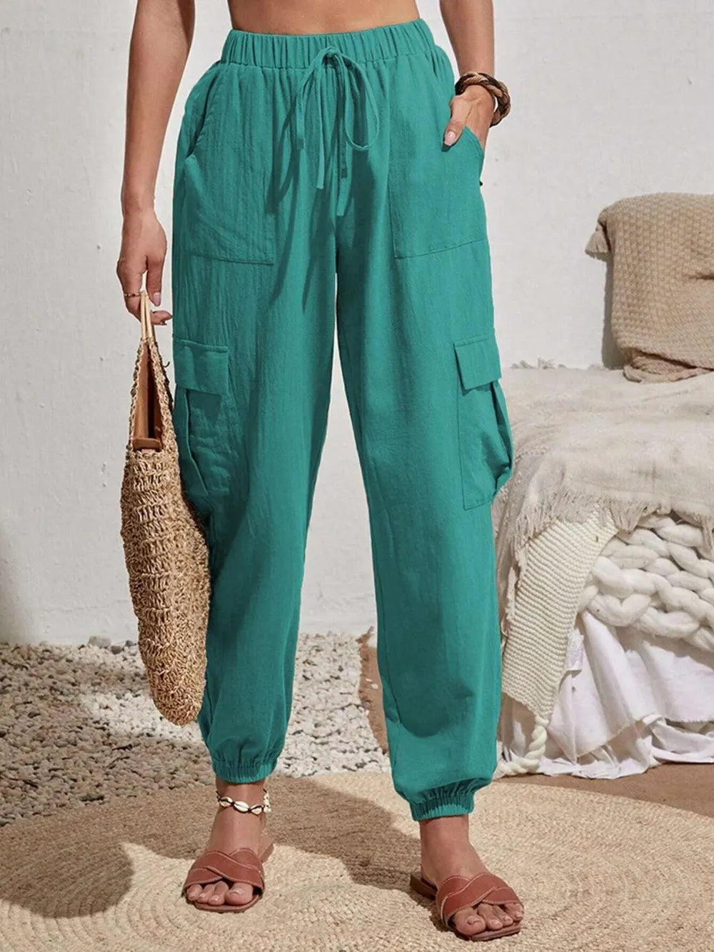 Drawstring joggers with cargo pockets in green, drawstring waist, side cargo pockets