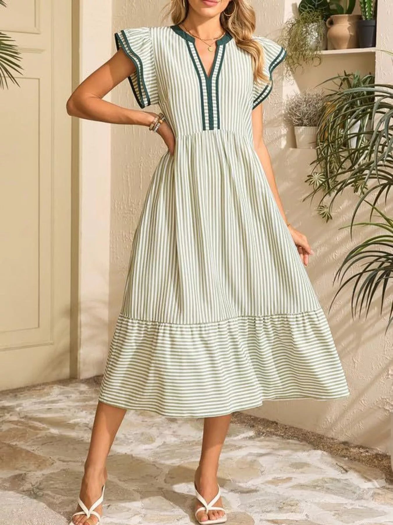 Striped Notched Ruffle Sleeve Dress in mint blue-and-white with pockets, midi length.