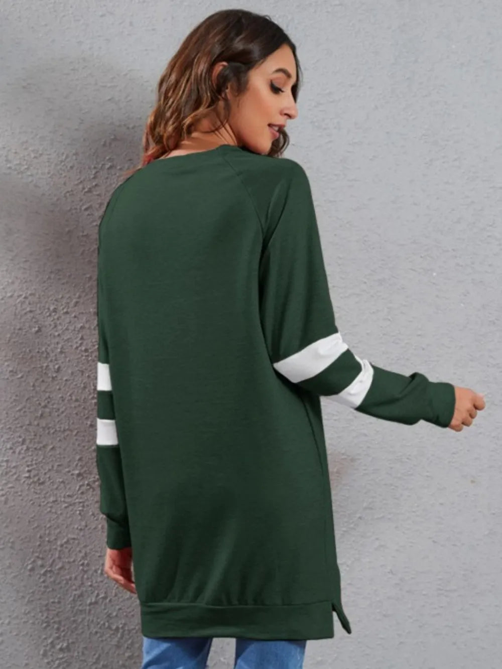 Dark green long-sleeve T-shirt from back with round neck and white striped cuffs