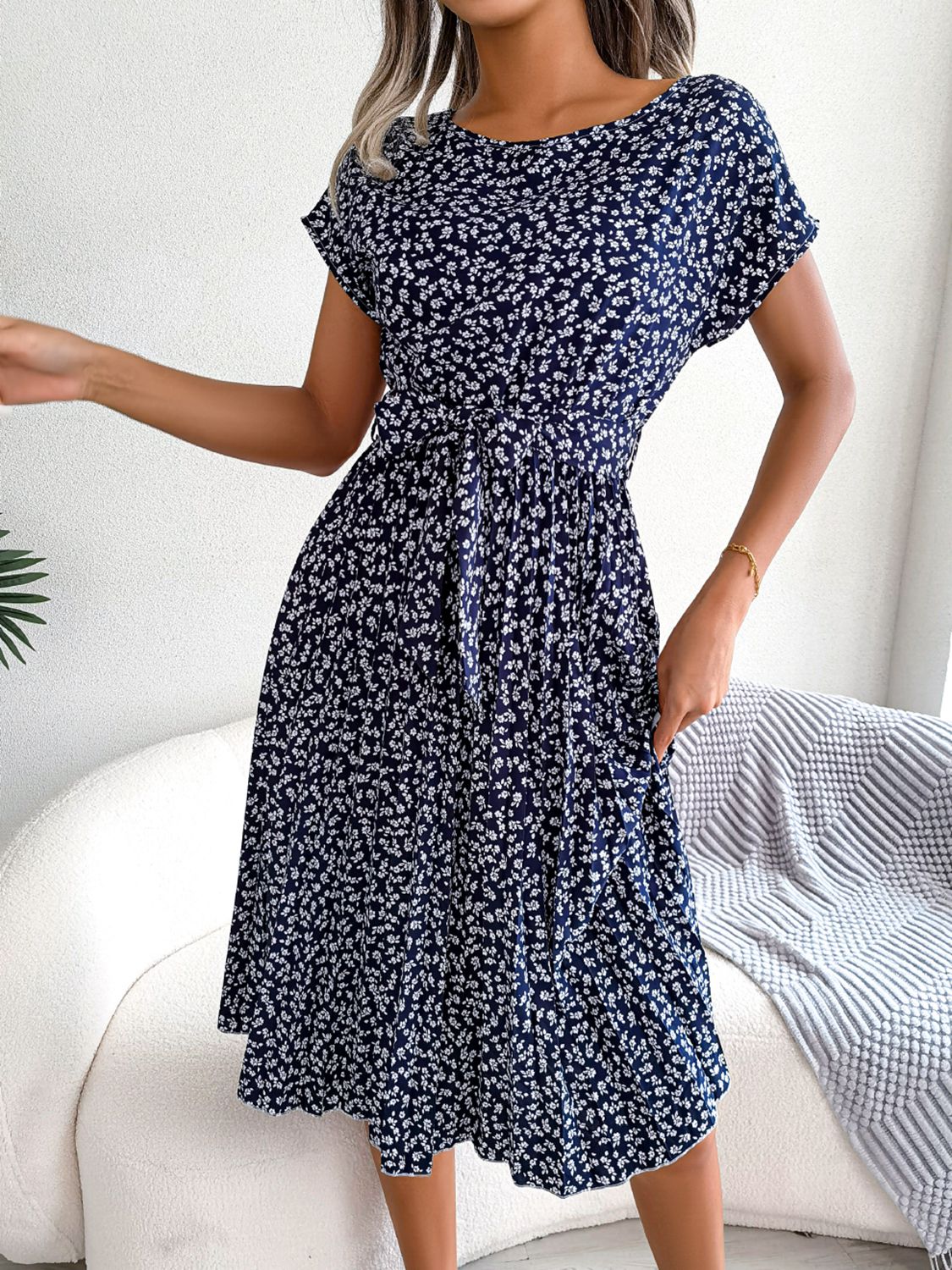 Navy ditsy floral pleated belted dress with short sleeves
