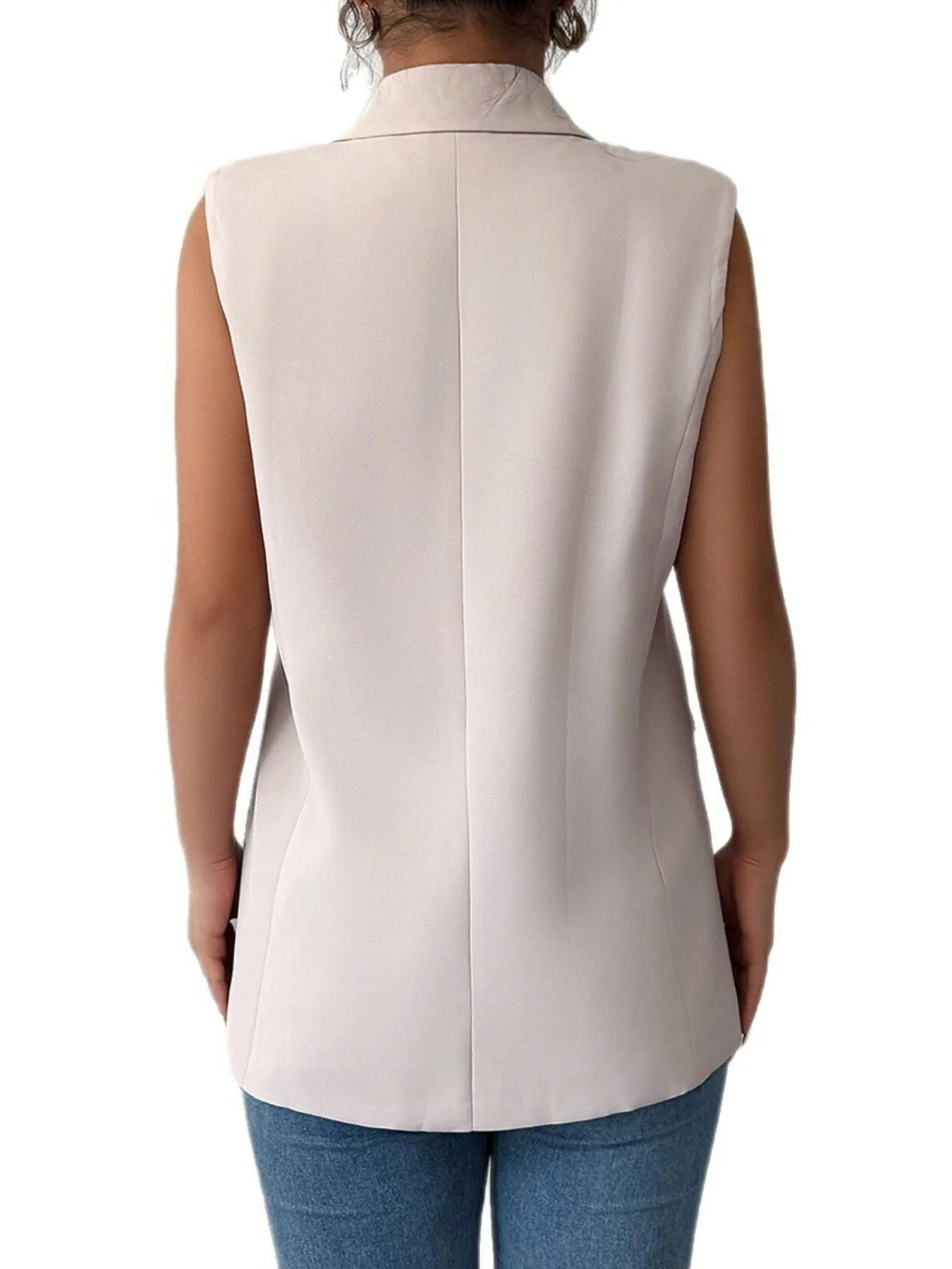Back view of eggshell sleeveless blazer with one-button single-breasted design