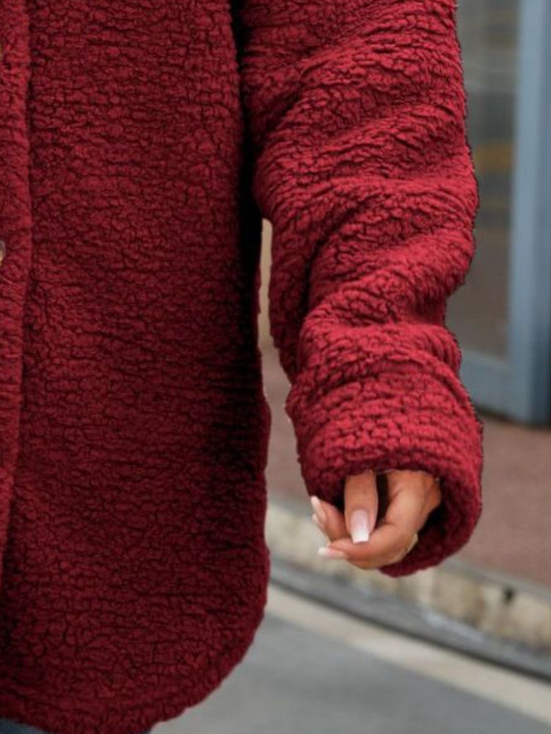 Wine red textured coat sleeve with button detail and gathered cuff