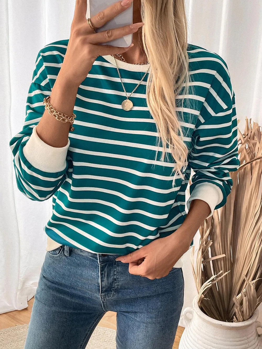 Turquoise and white striped long-sleeve sweatshirt with round neck and contrast cuffs
