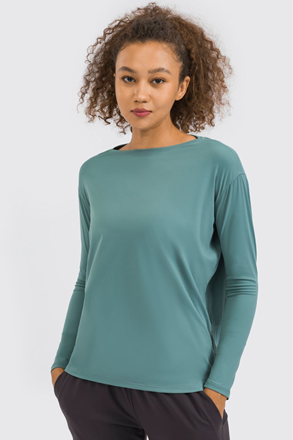 Teal loose fit active top, long sleeves with crew neckline