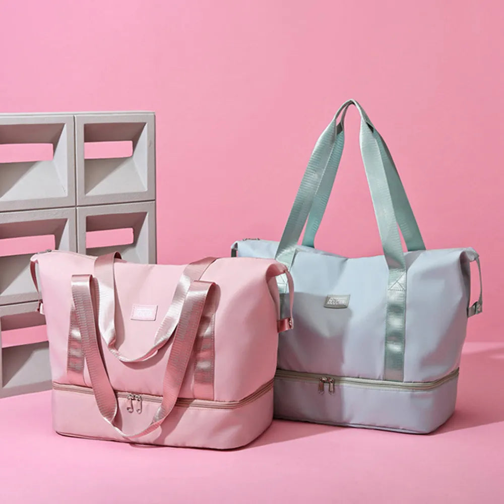 Pink nylon duffel bag with front pocket and dual shoulder straps