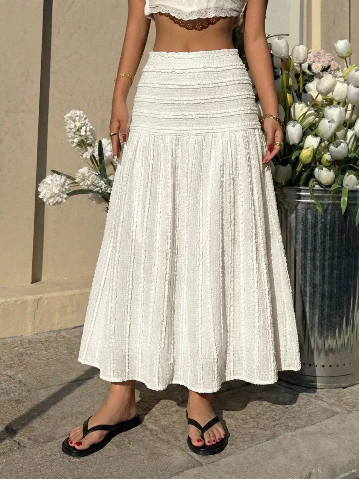 Ivory textured midi skirt with tiered ruffle panels and soft stretch waistband