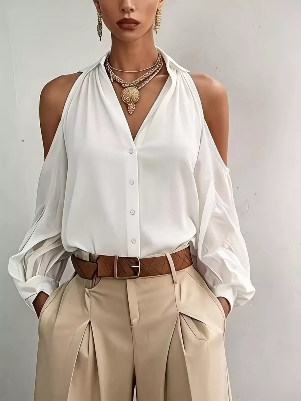 White cold-shoulder button-down stretch shirt with open shoulders and button front.