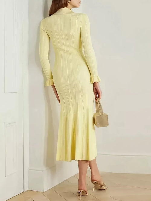 Pastel yellow knit sweater dress, long sleeves, crew collar, and back button detailing