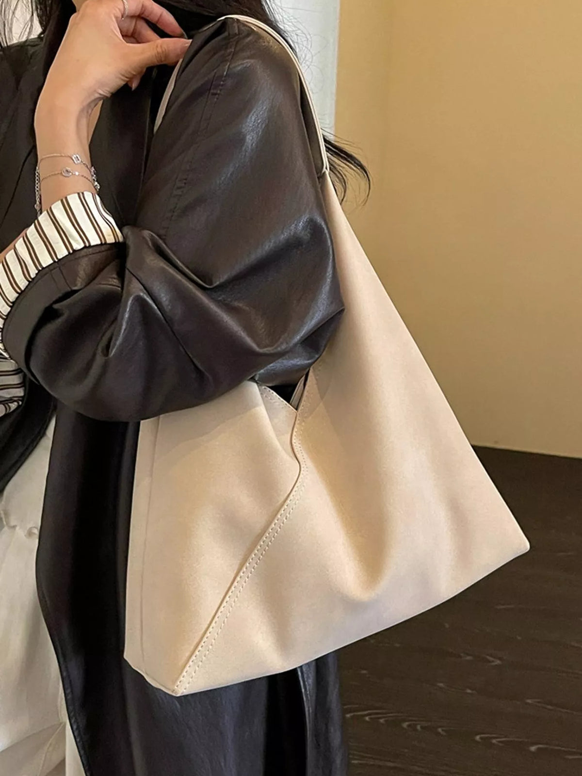 Large slouchy suede shoulder bag, black, soft hobo style with shoulder strap.