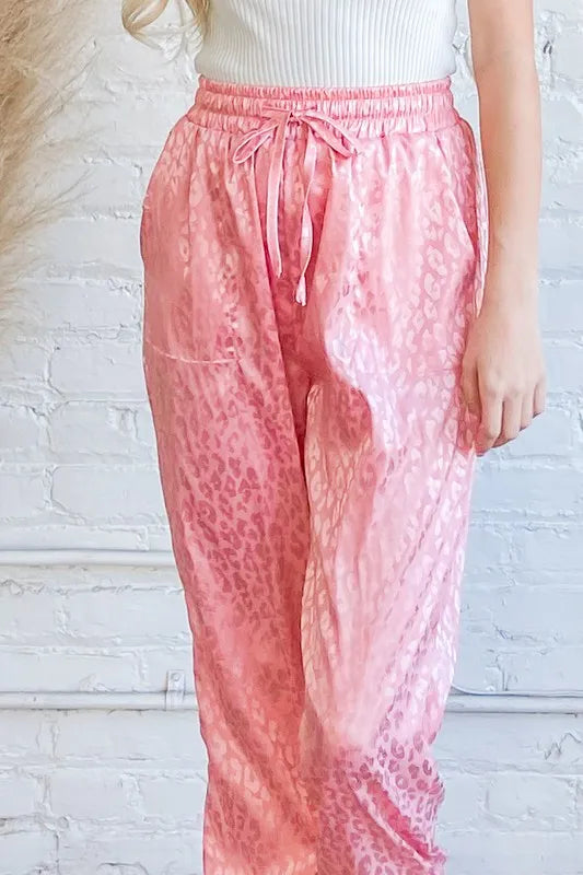 Pink satin leopard print joggers detail: drawstring waist and ruched waistband