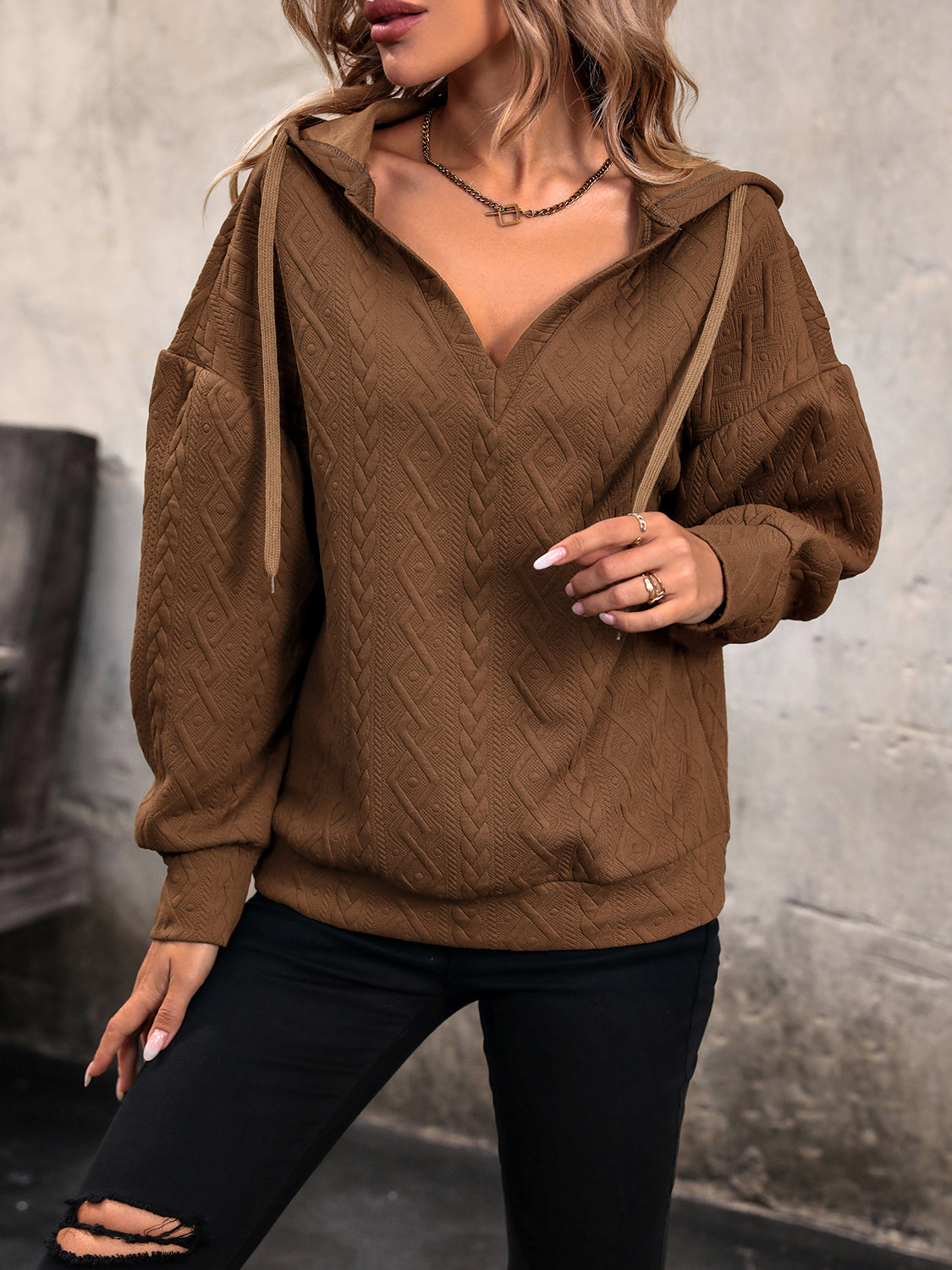 Chestnut brown textured hoodie with drawstring hood and relaxed dropped shoulders
