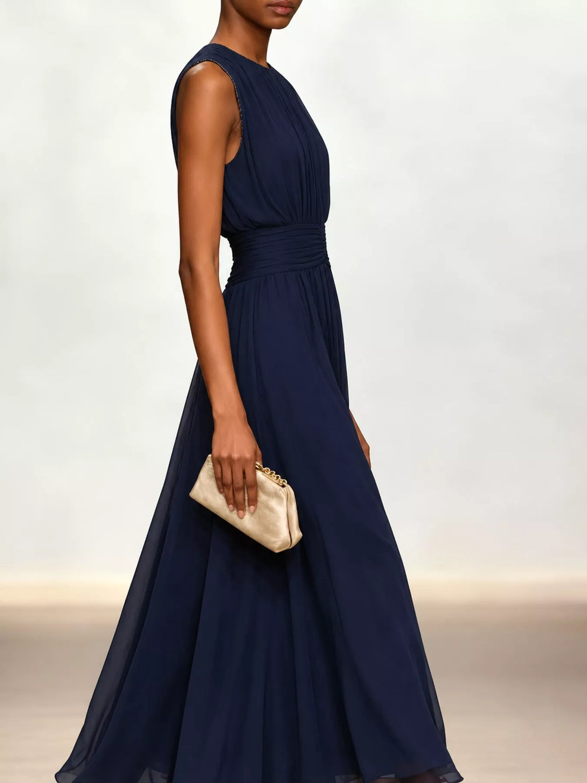 Navy sleeveless ruched chiffon maxi dress with gathered waist and sheer chiffon skirt