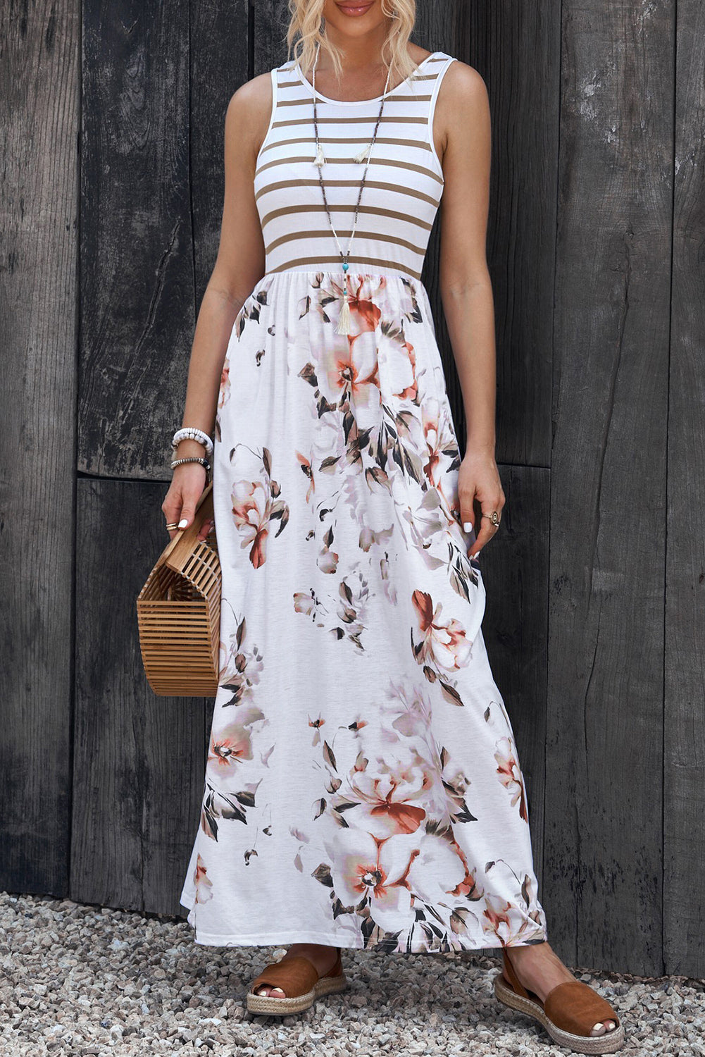 Sleeveless round-neck maxi dress with white-and-tan striped bodice and floral skirt