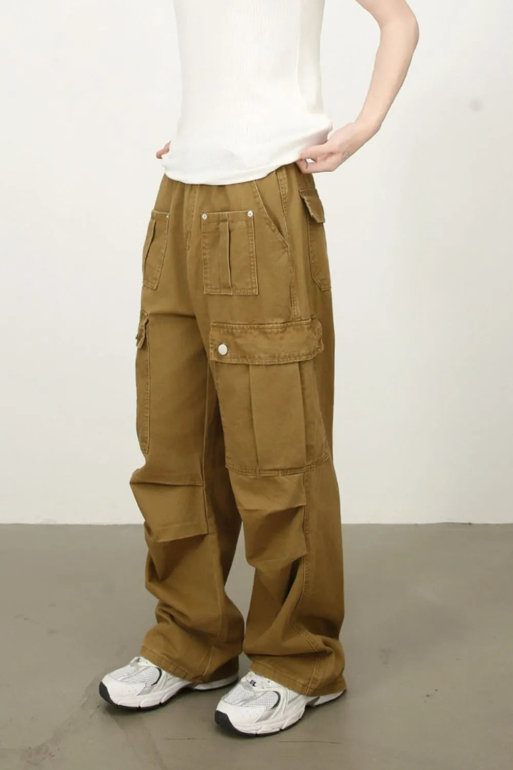 Khaki cargo jeans with front flap pocket and relaxed straight legs