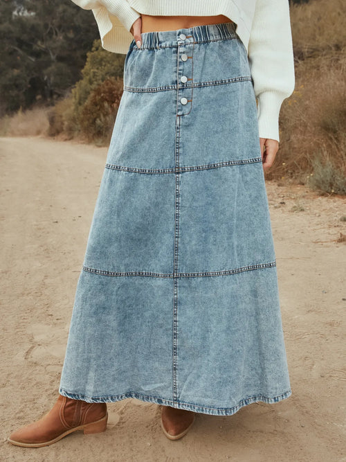 Light blue denim maxi skirt with tiered panels and button-front closure
