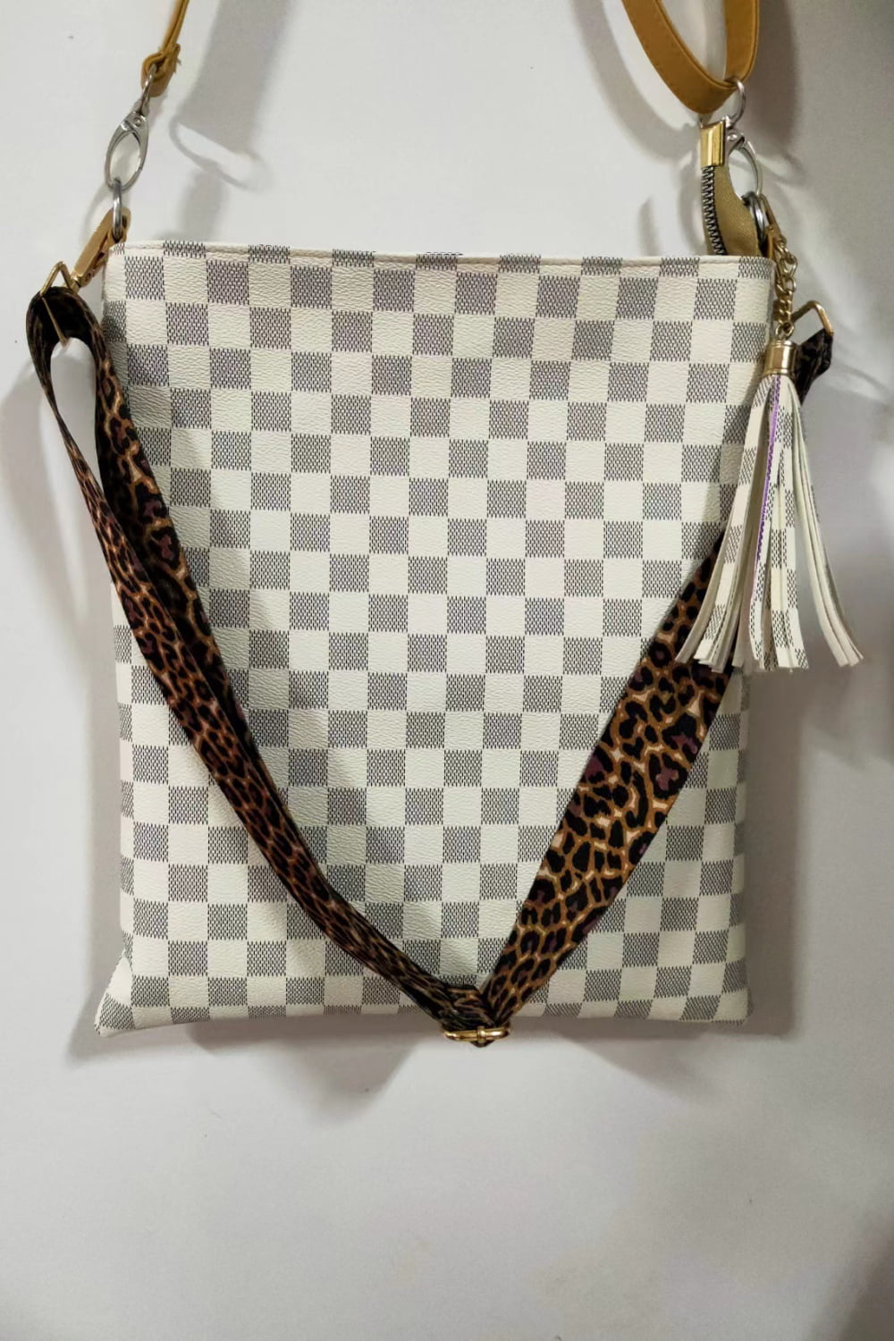 White check PU leather shoulder bag with leopard crossbody strap and tassel pull