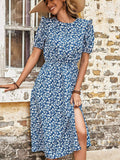 Blue floral midi dress with round neck and short puff sleeves, side slit