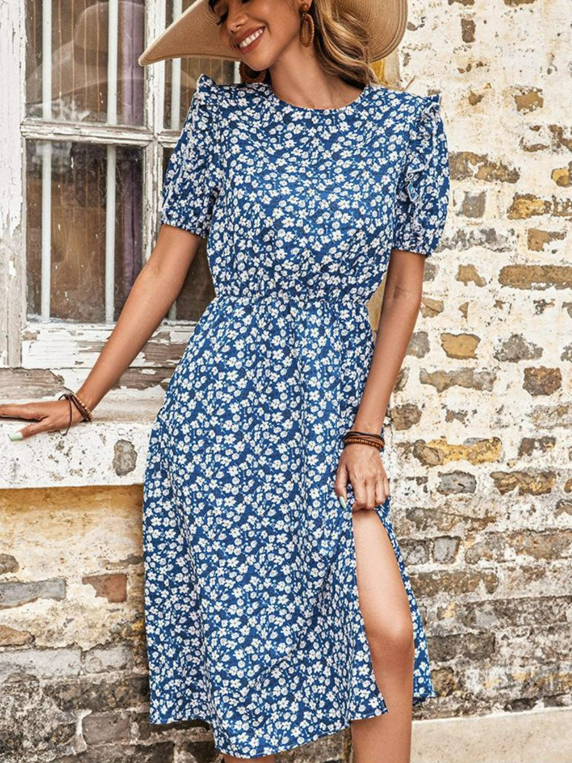 Blue floral midi dress with round neck and short puff sleeves, side slit