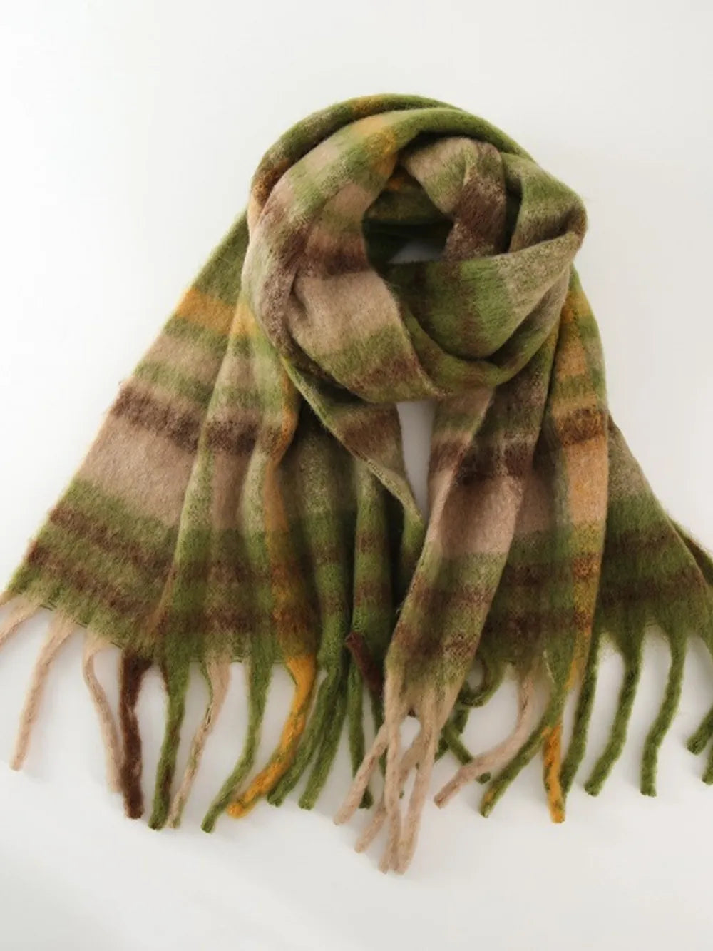 Plaid polyester scarf in olive and brown with fringed ends.