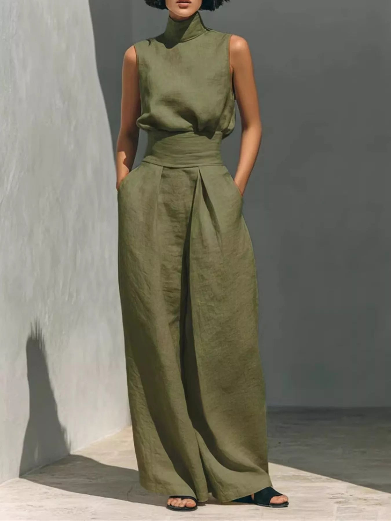 Olive green sleeveless turtleneck top with front waist knot and wide-leg pants