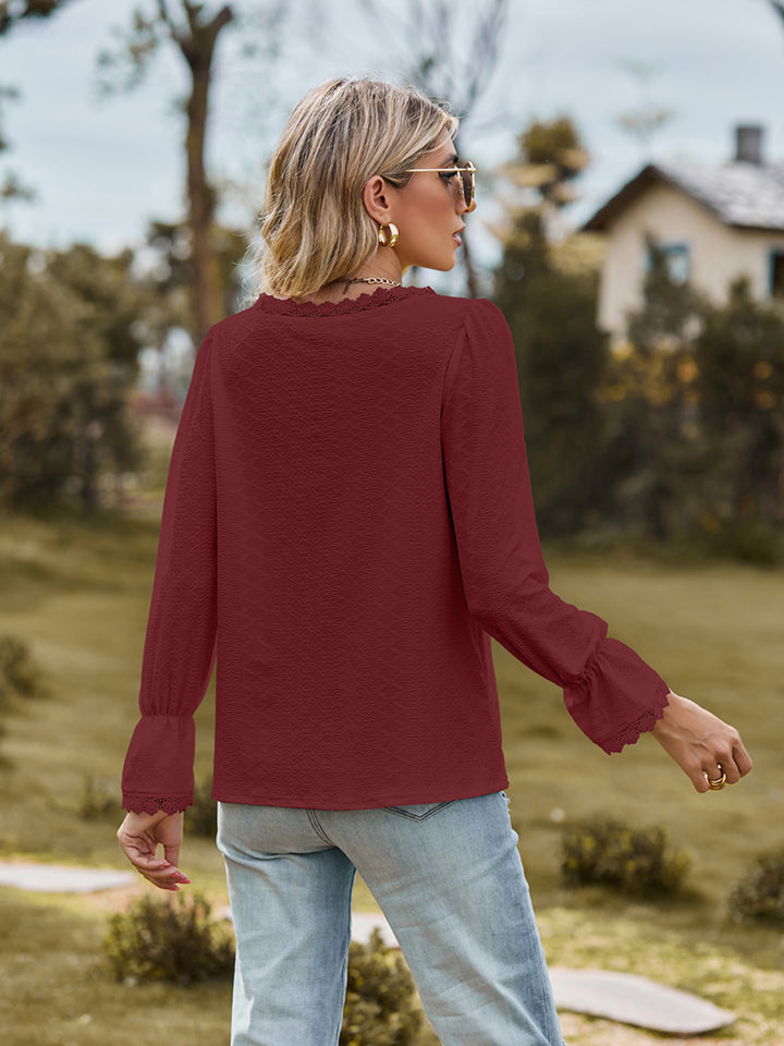 V-neck flounce-sleeve blouse in wine red, back view with long ruffled cuffs